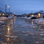 Thompson Residents Raise Concerns Over Flooding on Pipe Road in Burntwood Trailer Court - AI Generated Image